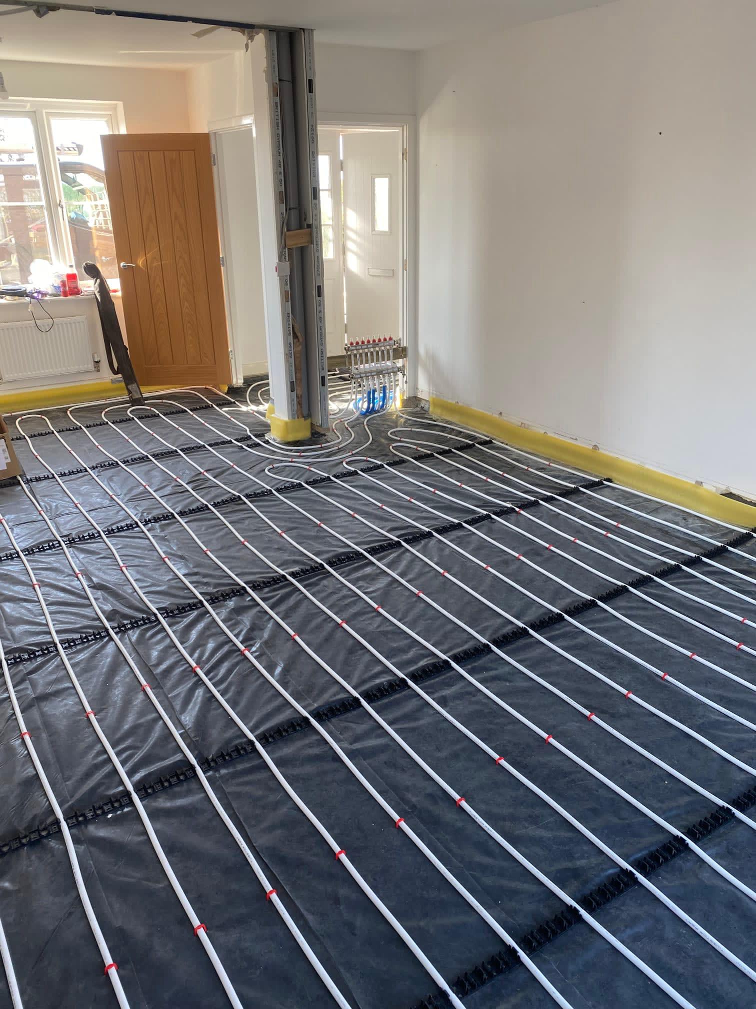Underfloor heating pipe laid in loops over a large open room
